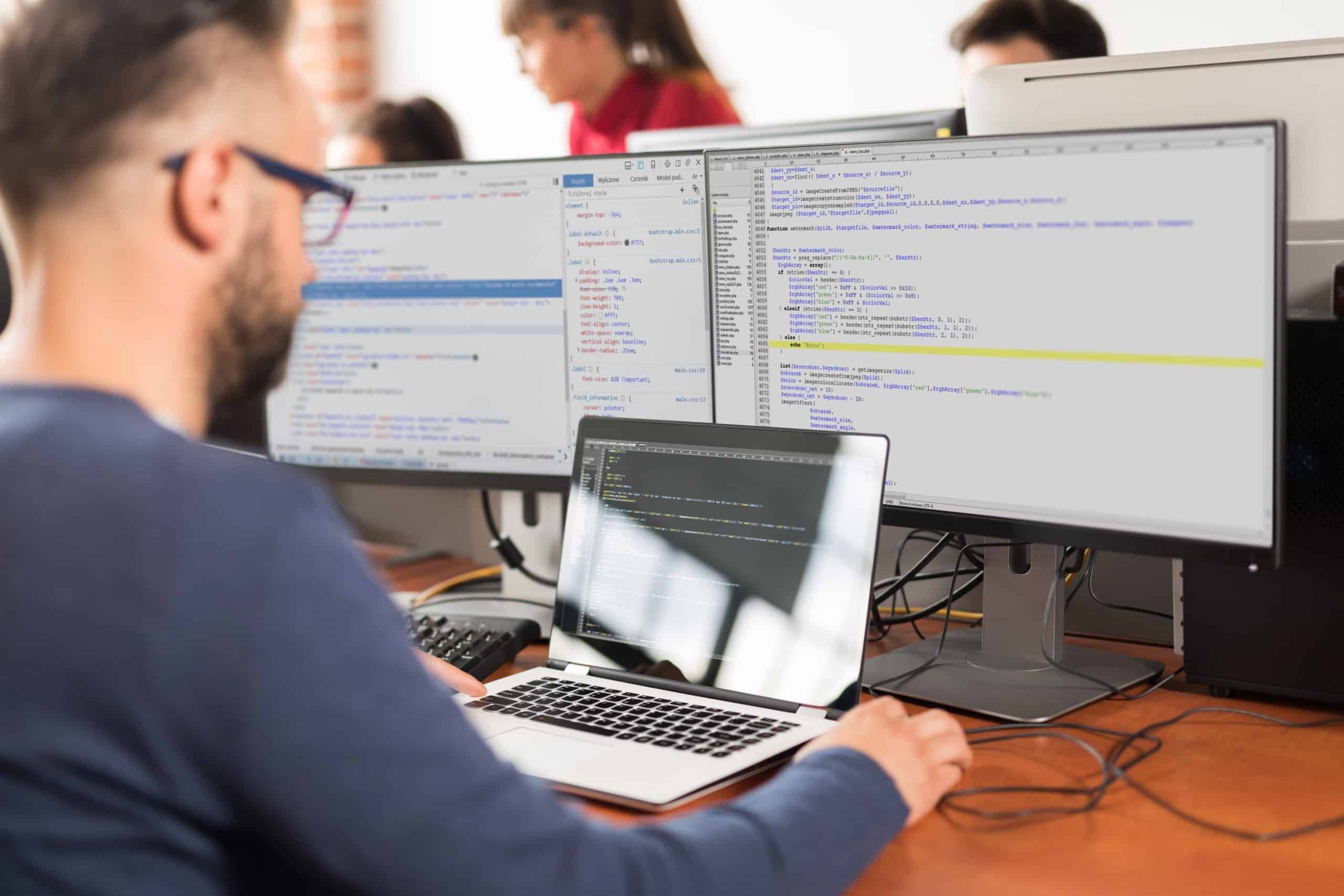 Data scientist working on code in an office