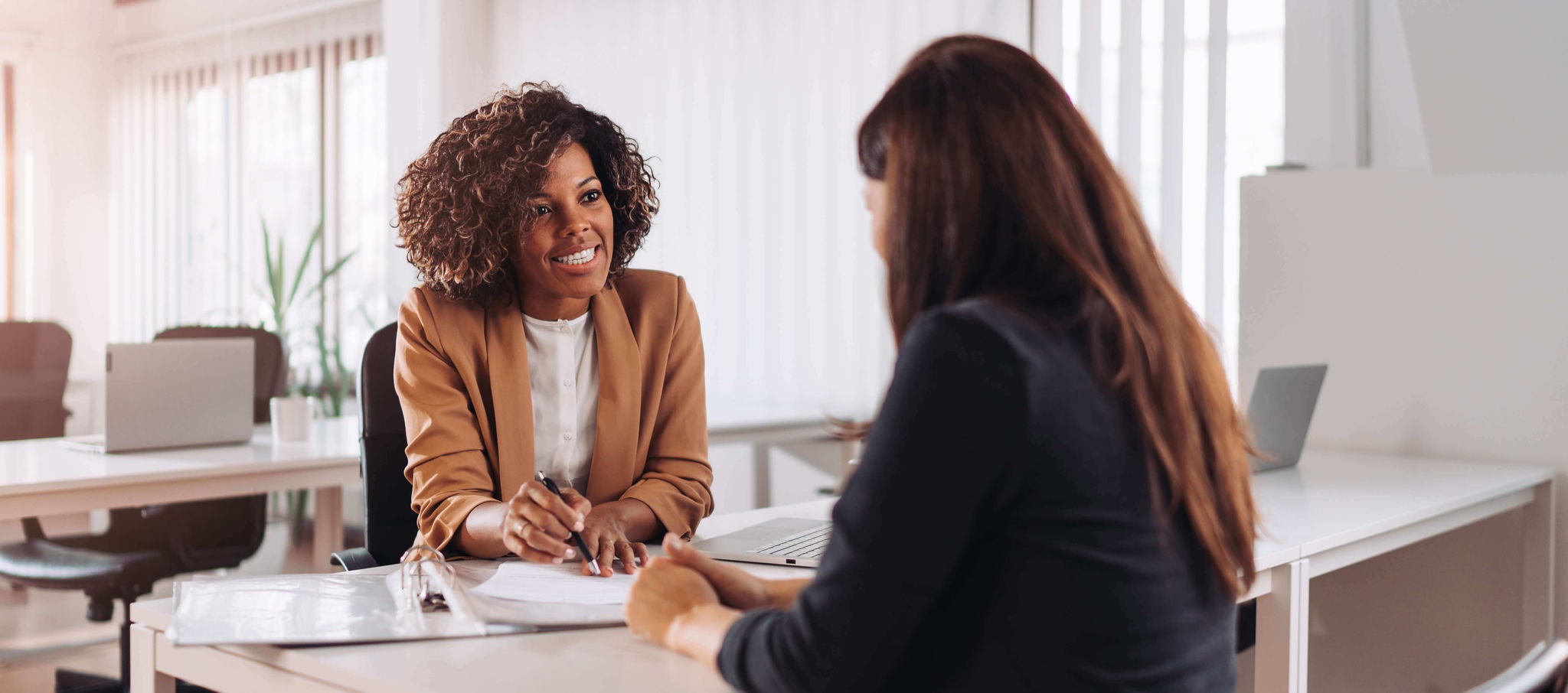 Worker reviewing paperwork with customer
