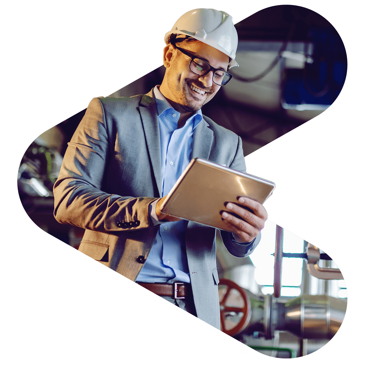 Man in a construction helmet looking at an ipad