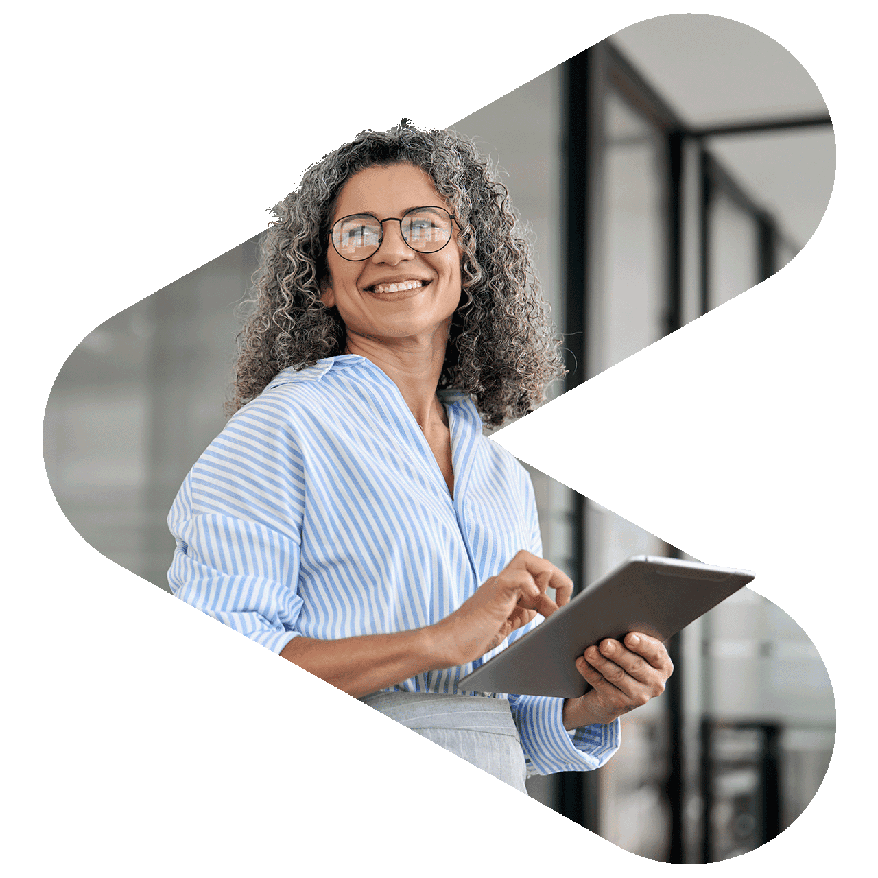 woman wearing glasses holding a tablet and smiling