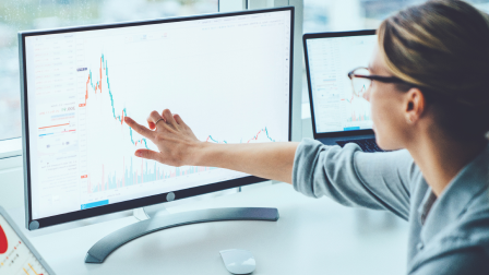 Data engineer sitting in front of a computer